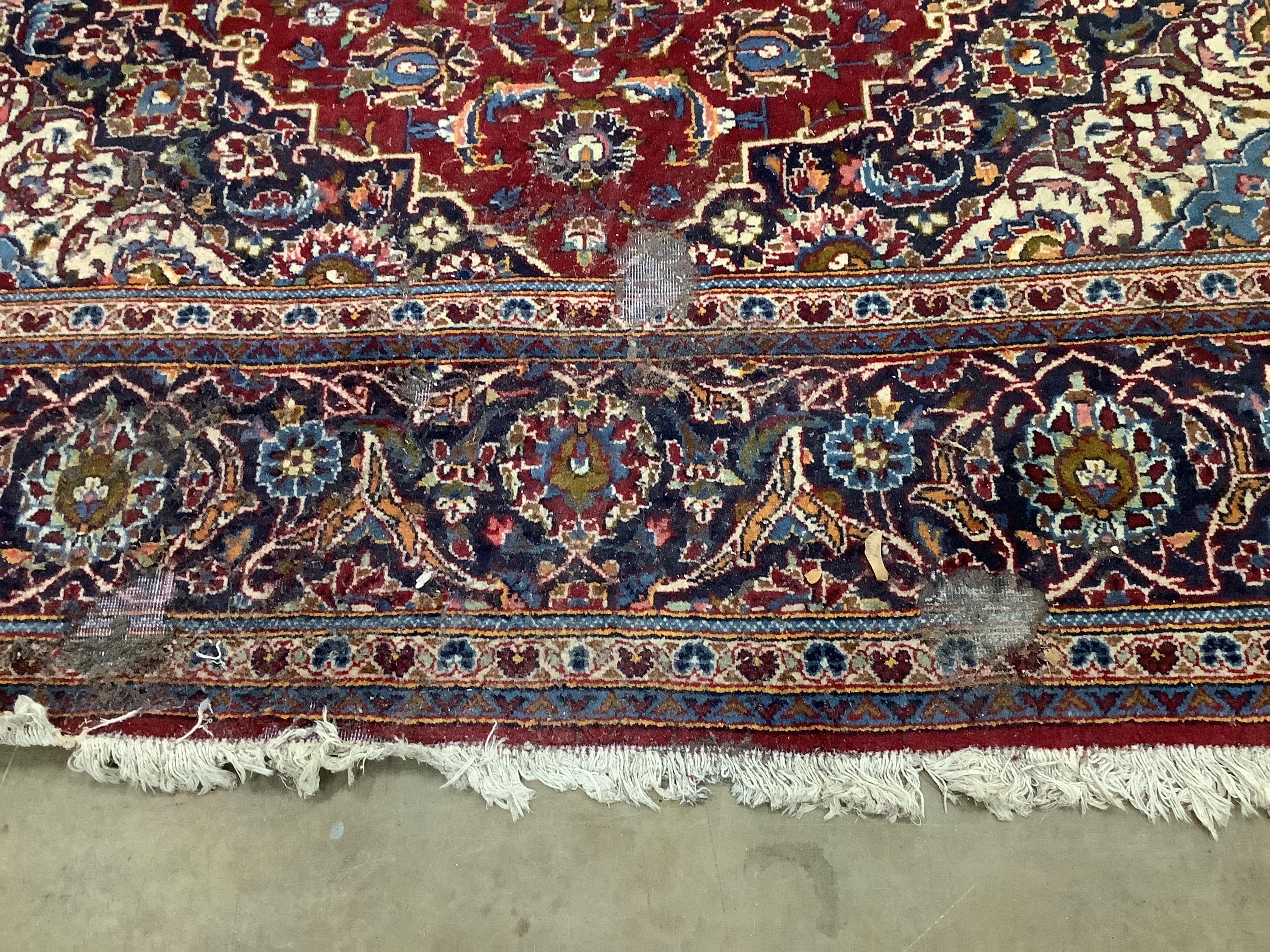 A North West Persian red ground carpet, 300 x 200cm